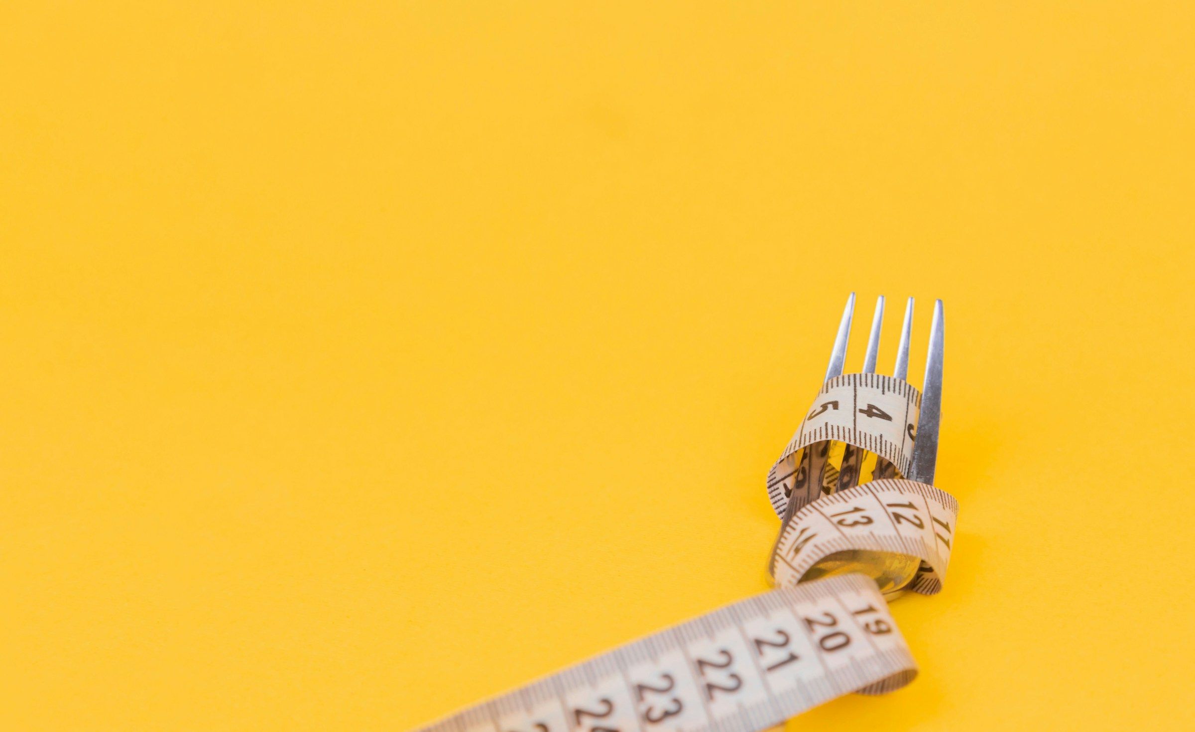 eating with fork - How Many Calories Should I Eat To Gain Muscle