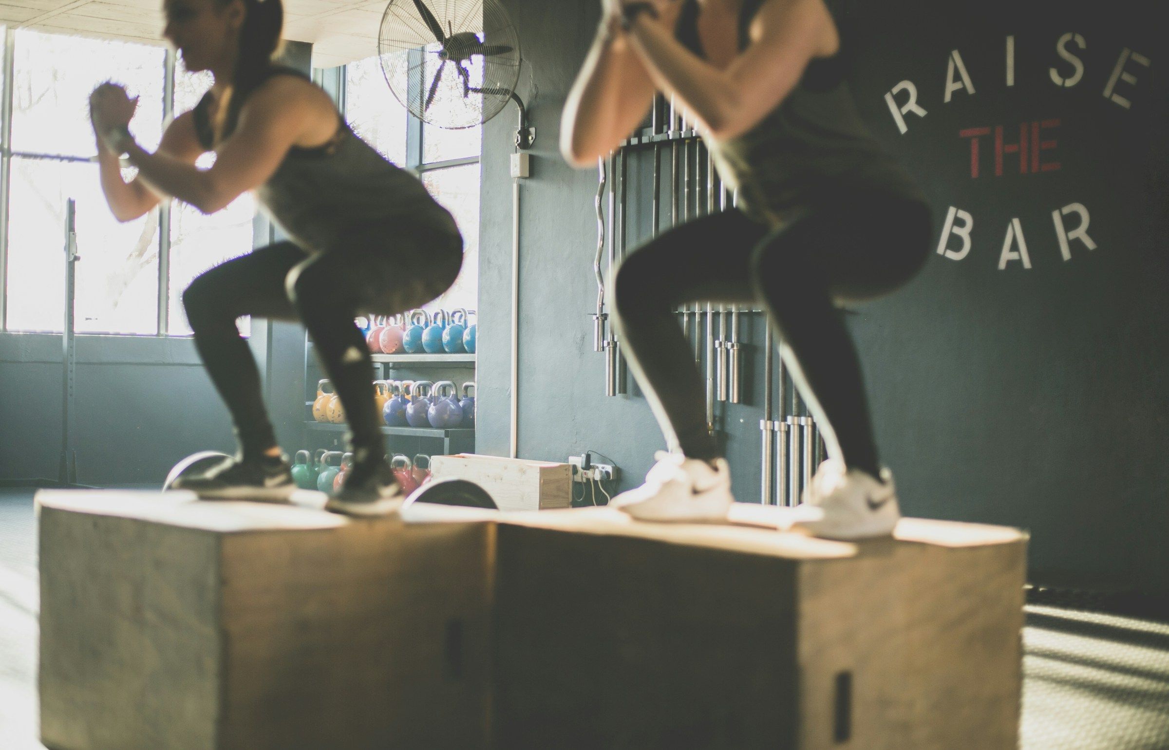 woman with a friend - How Many Calories Do Squats Burn